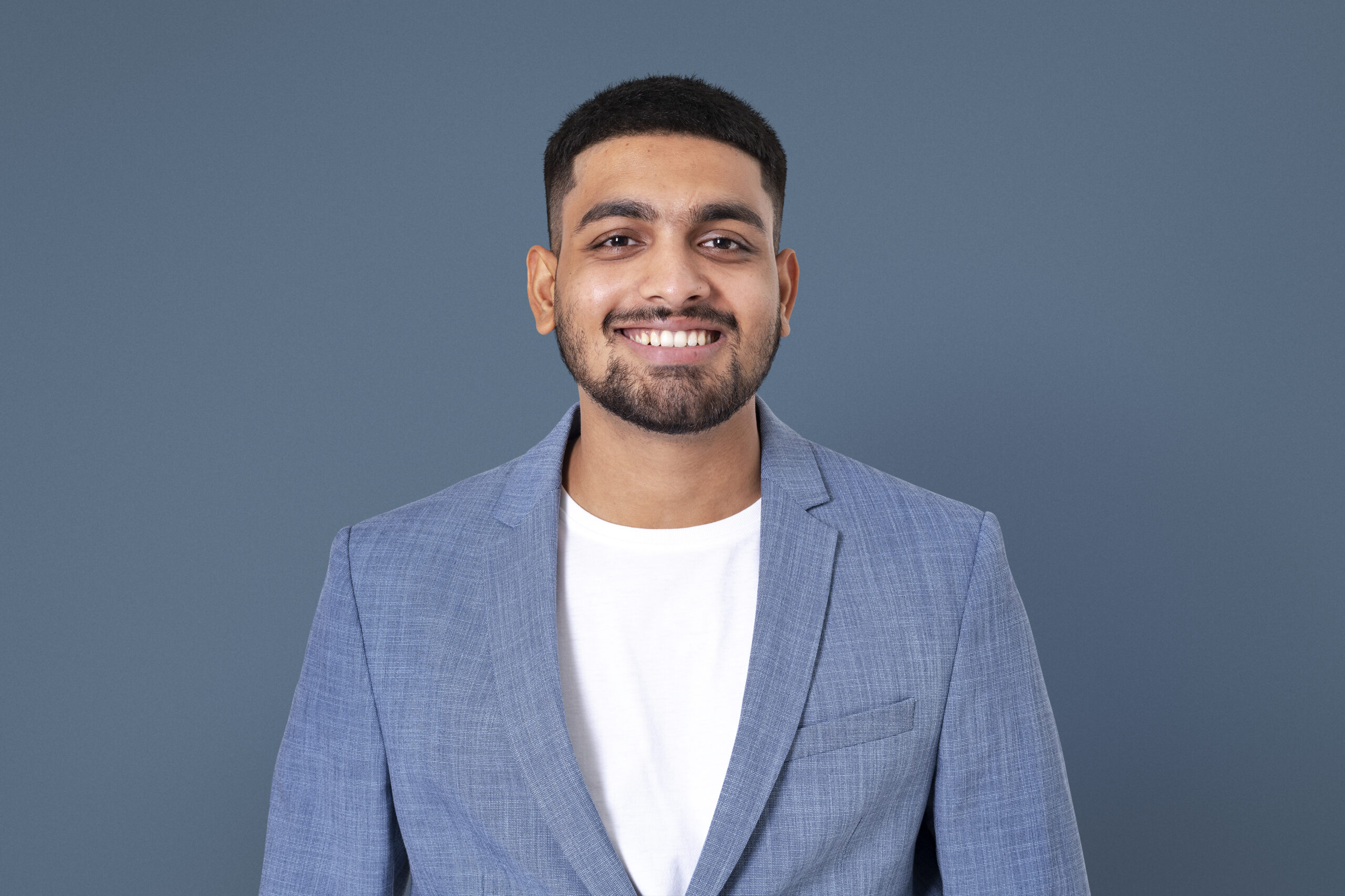 Cheerful Indian businessman smiling closeup portrait for jobs and career campaign